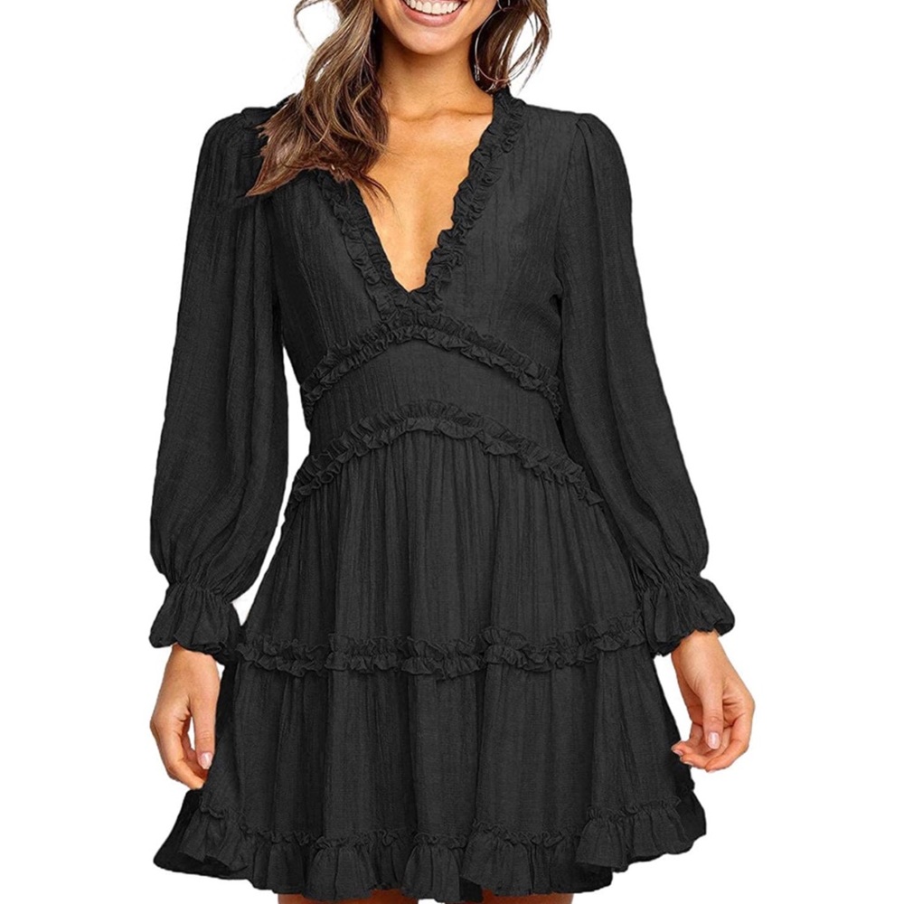 Woman’s short, black ruffle spring/ summer dress with open back
